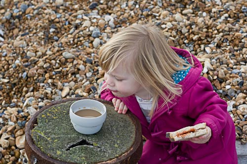 Blowing on Mummy's hot coffee for her