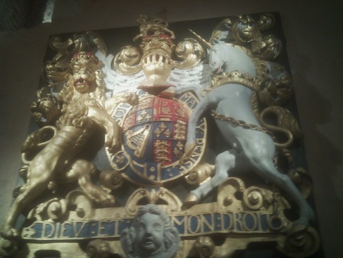 Coat of Arms - (meaning God and my right) is the motto of the Monarch of the United Kingdom in England. It appears on a scroll beneath the shield of the English version of the coat of arms of the United Kingdom